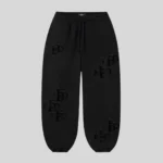 Black relaxed fit sweatpants with tonal black letter graphics, drawstring waistband and elastic cuffed ankles.