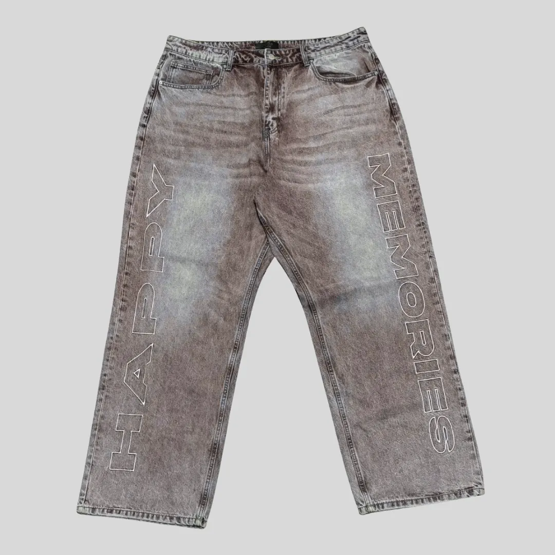 10 Grey washed denim jeans with large outlined vertical lettering on both legs and a relaxed straight-leg streetwear silhouette.