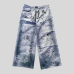 Light blue washed wide-leg jeans covered with black and grey handwritten graffiti-style graphics and abstract sketch markings.