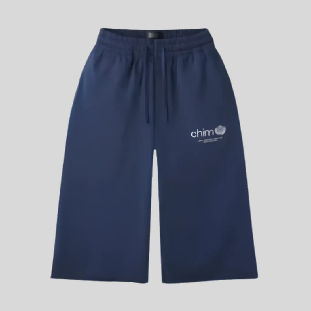 17 CHIM navy blue wide-leg sweat shorts with elastic waistband, drawstring waist and minimalist white front logo