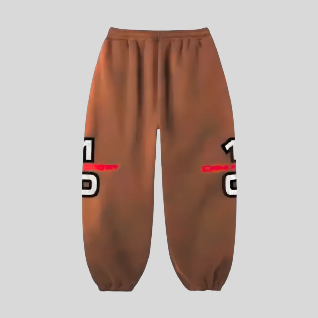 17 Brown relaxed-fit sweatpants with bold red, white and black graphic detailing across the outer legs, adjustable drawstring waist and elastic ankle cuffs.