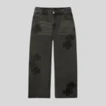 Black relaxed straight-leg sweatpants featuring subtle tonal graphic detailing across both legs, faded upper-leg accents, front pockets and a structured waistband.