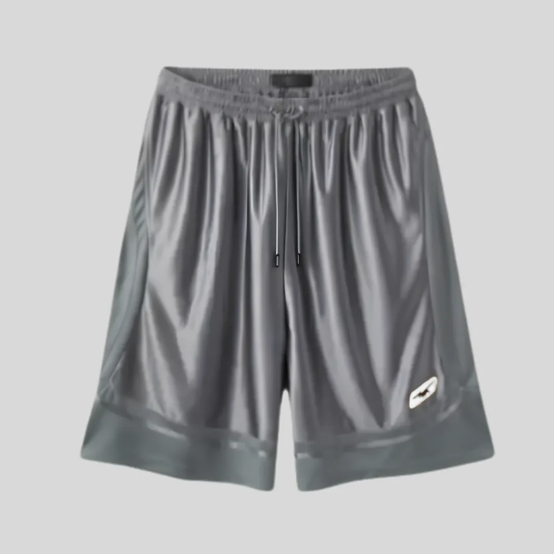 19 Charcoal grey wide-leg sweat shorts with elastic waistband, adjustable drawstring and subtle white side logo.
