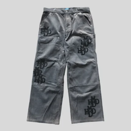 Grey wide-leg cargo pants with multiple utility pockets and tonal graphic details in a relaxed streetwear fit.