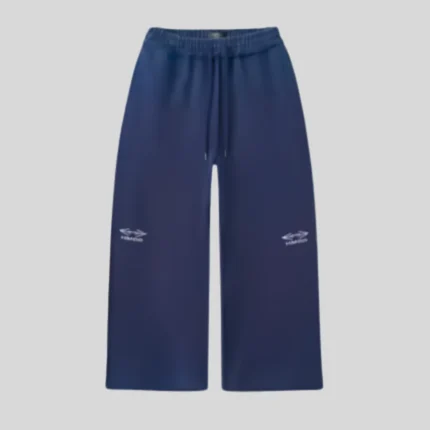 Navy blue relaxed wide-leg sweatpants featuring an elasticated drawstring waistband and small matching graphic details on both legs.