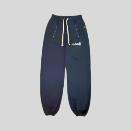 Navy blue relaxed sweatpants with cream drawstring, decorative rhinestone-style detailing around the pockets and small light-colored logo.