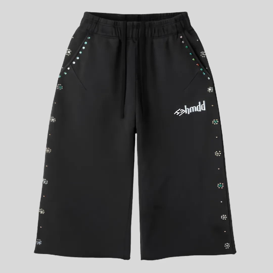 22 Black relaxed-fit sweatpants with multi-color rhinestone-style embellishments around the pockets and along the outer legs.