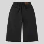 Black relaxed-fit sweatpants with multi-color rhinestone-style embellishments around the pockets and along the outer legs.