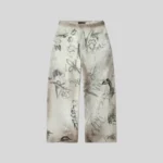 Cream sweatpants featuring an all-over hand-drawn graffiti-style print with abstract sketches, doodles and handwritten graphics.