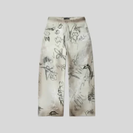 Cream sweatpants featuring an all-over hand-drawn graffiti-style print with abstract sketches, doodles and handwritten graphics.