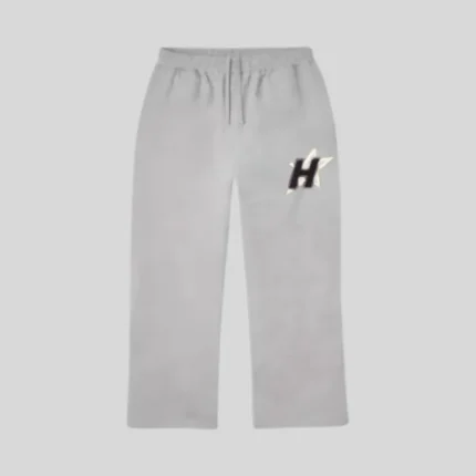 White relaxed-fit sweatpants with a contrasting black and light star-inspired logo on the upper leg.