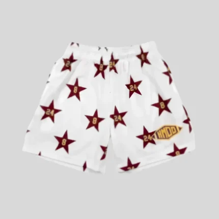 White casual shorts with repeated burgundy star graphics, gold number details, elastic drawstring waistband, and relaxed streetwear fit.