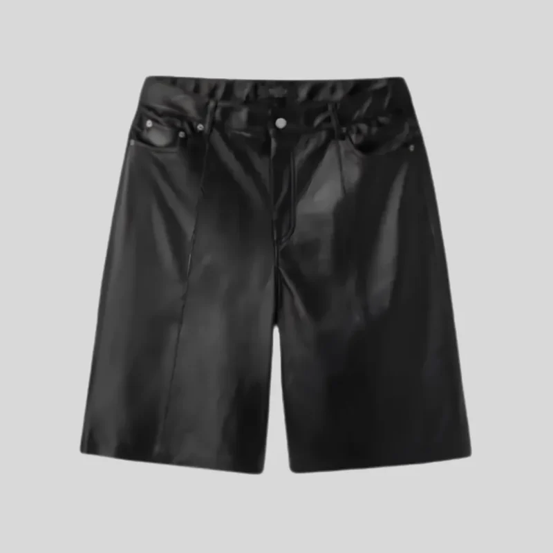 Black glossy denim shorts with classic five-pocket styling, belt loops, button and zip closure, and relaxed streetwear silhouette.