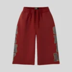 HMDD red basketball shorts with oversized charcoal side graphics and relaxed streetwear styling