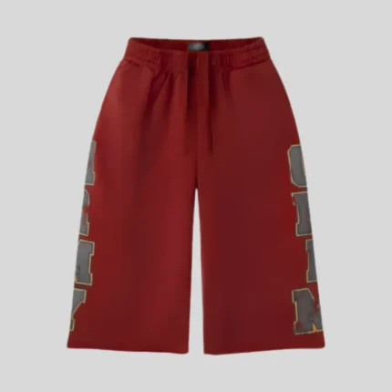 HMDD red basketball shorts with oversized charcoal side graphics and relaxed streetwear styling